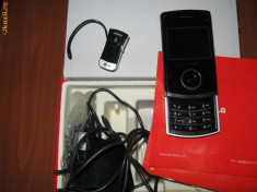 Vand telefon LG KU 580 + casca bluetooth foto