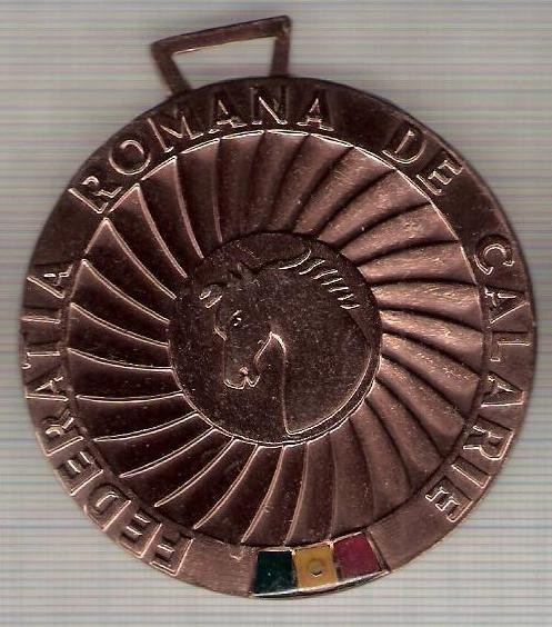 C74 Medalie Federatia Romana de Calarie -Camp.Rep.de Calarie, Finala 1987 -marime circa 59x65 mm -greutate aprox. 26 gr -starea care se vede