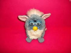 furby cu functii ce rade mananca toarce stranuta canta doarme si isi misca ochii gura si urechile de la tigger foto