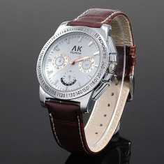 Ceas barbati ALIAS KIM (AK HOMME SUA brand FOSSIL) superb quartz curea piele naturala maro cadran argintiu, pret site 112 $+cutie cadou+card garantie foto