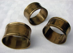 Trei inele pentru servetele din bronz foto