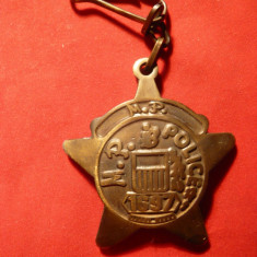 Breloc - Politia Americana ,cu numar , bronz ,h= 6 cm