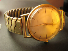 Dugena Precison 596, Swiss Made, placat cu aur 14k, an 1955 functioneaza perfect, intretinut, curea elastica de metal. foto