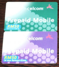 MALAYSIA. 2 CARTELE TELEFON CELCOM PREPAID MOBILE foto