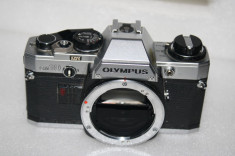 Aparat foto cu film OLYMPUS OM-10 body , defect, pentru piese/reparat, neverificat de specialist foto