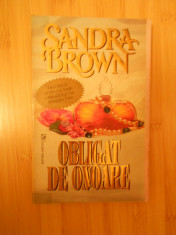 SANDRA BROWN--OBLIGAT DE ONOARE foto