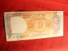 Bancnota 10 rupii India cal.F.Buna , are 2 gaurele de ace