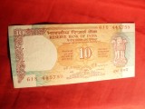 Bancnota 10 rupii India cal.F.Buna , are 2 gaurele de ace