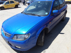 Dezmembrez Mazda 323f an 2002 foto