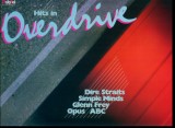 -Y- HITS IN OVERDRIVE - DIRE STRAITS / SIMPLE MINDS / GLENN FREY / DISC VINIL