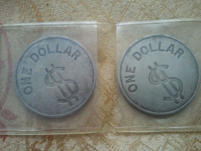 Lot 2 medalii One Dollar $,44 grame + taxele postale = 50 roni