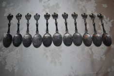 Set format din 11 tacamuri , linguri decorative datate si stantate din zinc foto