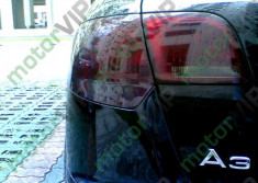 Spray stopuri tuning cu vopsea transparent fumurie foto