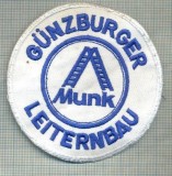 73 - EMBLEMA MANECA-GUNZBURGER LEITERNBAU -MUNK -GERMANIA -starea care se vede