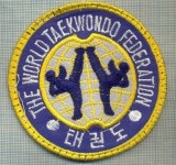 154 -EMBLEMA - SPORTIVA -THE WORLD TAEKWONDO FEDERATION -starea care se vede