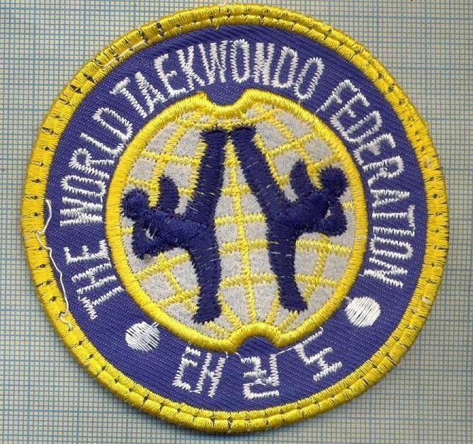 154 -EMBLEMA - SPORTIVA -THE WORLD TAEKWONDO FEDERATION -starea care se vede