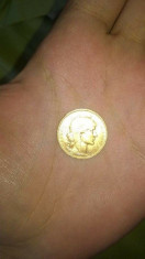 moneda de aur foto