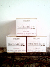 Crema fata zi +crema ochi, antirid Time Reversing Intense Oriflame, sigilate foto