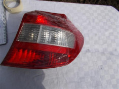 Stop stanga pe Haion VW Golf 5 cod piesa original 1K6945093E foto