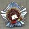 ZET1373 INSIGNA -FRUNTAS IN INTRECERE -ANUL 1977 - LA BAZA DRAPELELE PCR SI RSR
