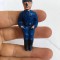 Figurina plastic, politist in pozitie sezut, cu tija metalica in fund, 5.5cm