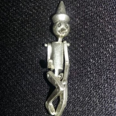 Figurina argintata de colectie tip Pinochio,deosebita,9,3gr,T.GRATUIT