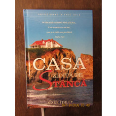 CASA ZIDITA PE STANCA-MARK FINLEY