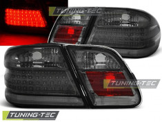 Triple MERCEDES W210 95-03.02 SMOKE LED foto