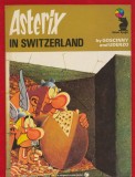 Goscinny Uderzo - Asterix in Switzerland, Carte Benz Desenate Engleza, 1976, 48 pagini, 20x15 cm