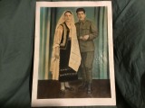 Fotografie veche colorizata format mare barbat in uniforma militara si femeie in costum popular !