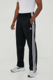 Cumpara ieftin Adidas Originals pantaloni de trening culoarea negru, cu imprimeu IJ7055