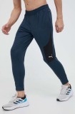 Cumpara ieftin Puma pantaloni de trening Cloudspun culoarea albastru marin, modelator