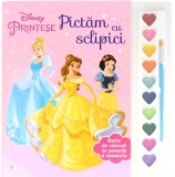 Disney. Prințese. Pictăm cu sclipici. Carte de colorat cu pensulă și acuarele, Litera