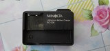 Incărcător original Minolta pentru baterii Li-Ion Model: BC-300 Ieșire (Output): 4.2V ⎓ 650mA pentru &icirc;ncărcarea bateriilor Minolta de tip NP-200