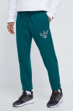 Cumpara ieftin Adidas Originals pantaloni de trening din bumbac culoarea verde, cu imprimeu