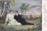 Cuplu romantic asezat pe pajiste in timpul unui apus de soare (circulata 1906)