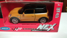 macheta new mini hatch - welly, 1/36, noua. foto