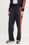 Puma pantaloni de trening femei, culoarea albastru marin, cu imprimeu, 629794