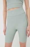 Cumpara ieftin Fila pantaloni scurți de antrenament Cassino femei, culoarea verde, neted, high waist