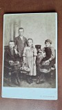 Fotografie pe carton, grup de 4 copii, inceput de secol XX