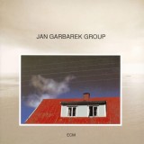 Photo With Blue Sky, White Cloud, Wires, Windows And A Red Roof | Jan Garbarek