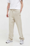 Tommy Jeans pantaloni de trening din bumbac culoarea bej, neted