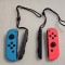 Set 2 x Controller Joy-Con NINTENDO Switch, albastru-rosu + sistem de fixare inchietura