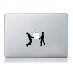 Men holding Apple sticker laptop