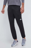 The North Face pantaloni de trening Reaxion culoarea negru, neted