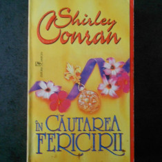 SHIRLEY CONRAN - IN CAUTAREA FERICIRII