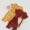 Set de 2 salopetele cu maneca scurta din bumbac organic si modal - Caramiziu/ Sofran BabyCosy (Marime: 3-6 Luni)