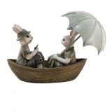 Cumpara ieftin Figurine Iepurasi Paste in barcuta din polirasina 14x10x12 cm