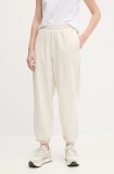 Puma pantaloni de trening femei, culoarea bej, neted, 629753