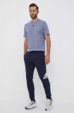Adidas pantaloni de trening culoarea albastru marin, cu imprimeu